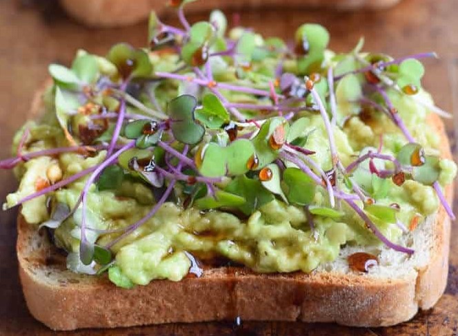 avocado toast with cabbage and kale microgreens